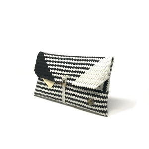 Black and white clutch at a 45-degree angle.