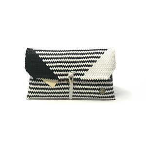 Handmade black and white clutch facing the front.