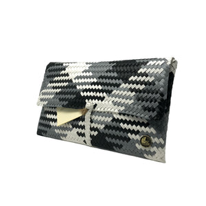 Black, grey and white clutch at a 45-degree angle.