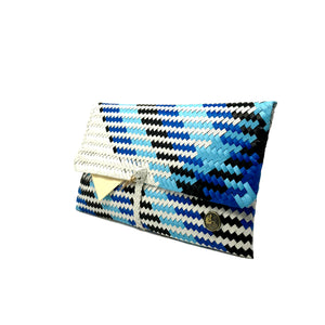 Blue, black and white clutch at a 45-degree angle.