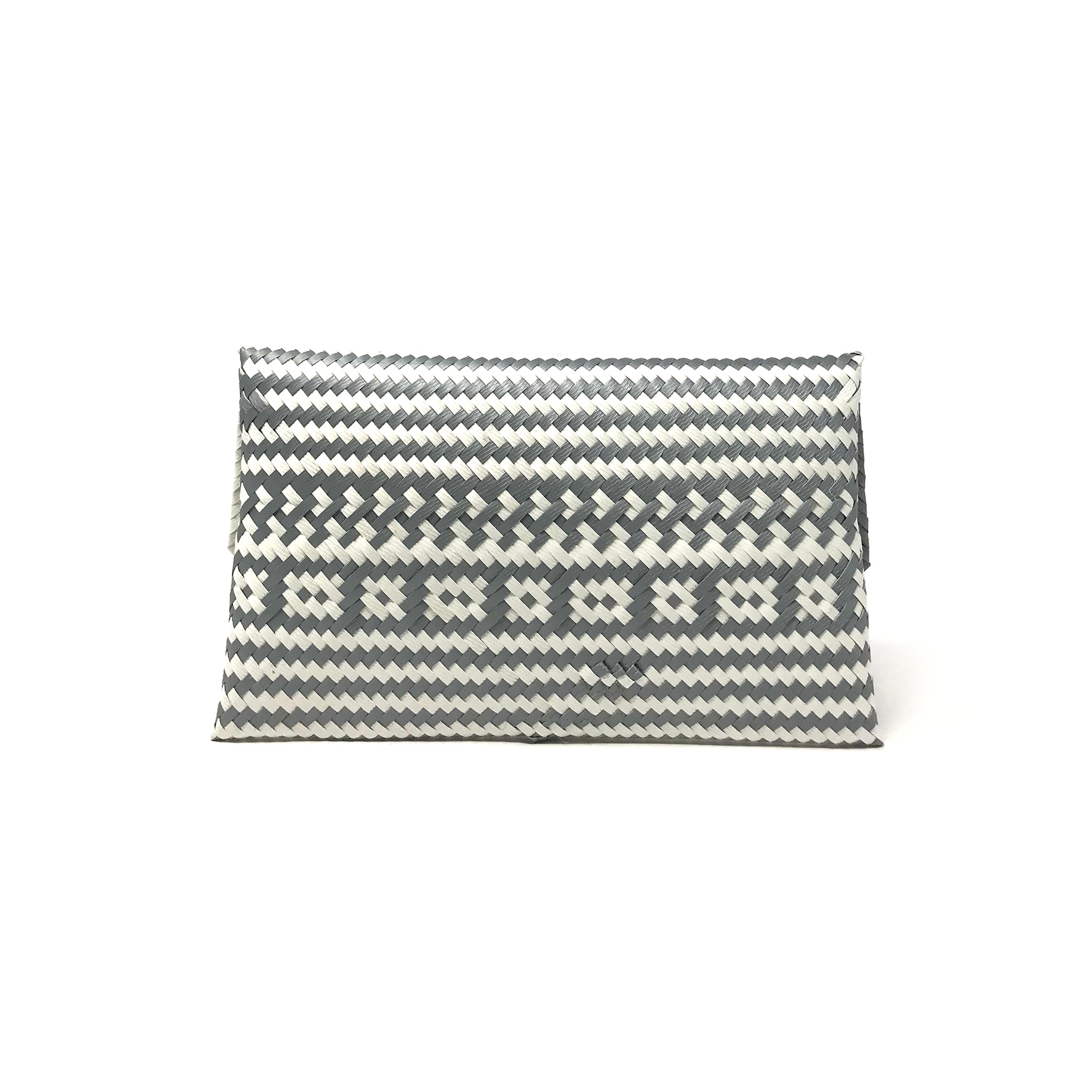 Grey and white clutch facing backwards.