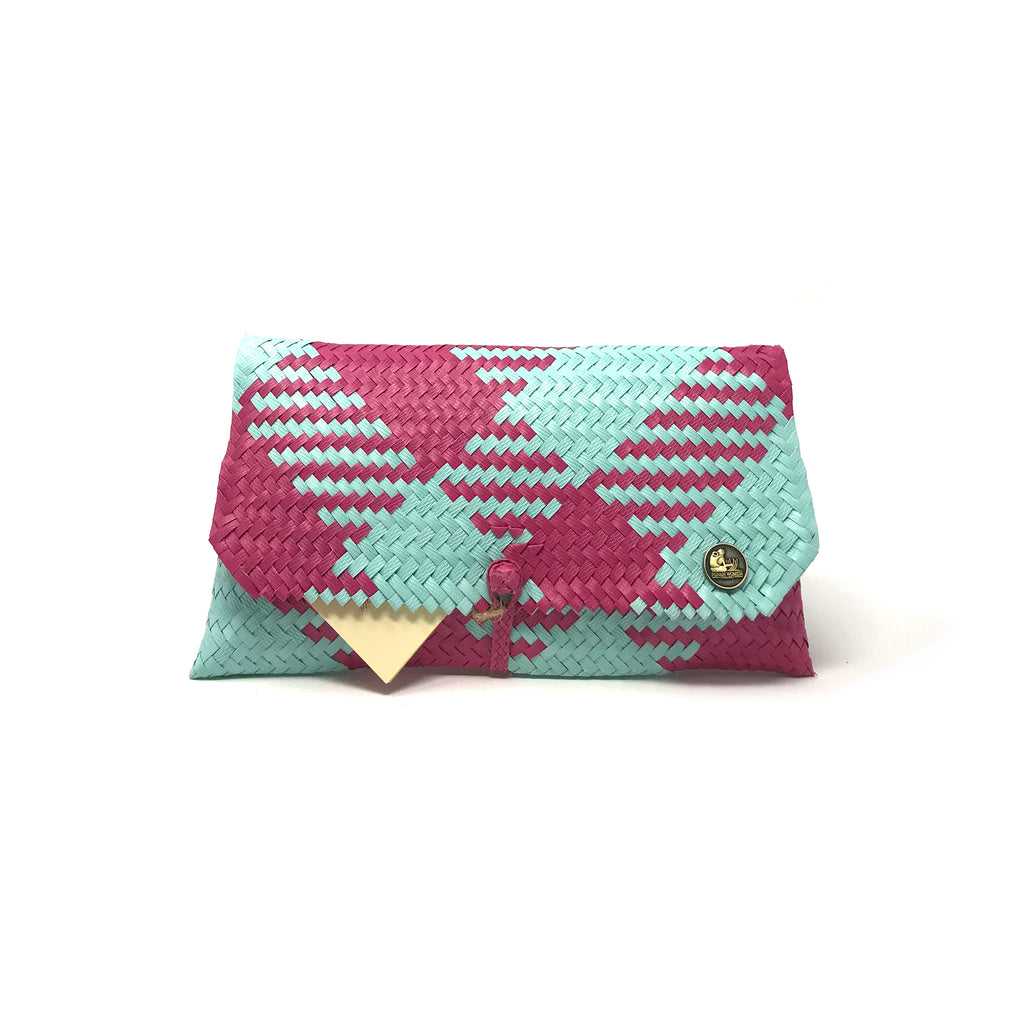 Handmade turquoise and magenta clutch facing the front.