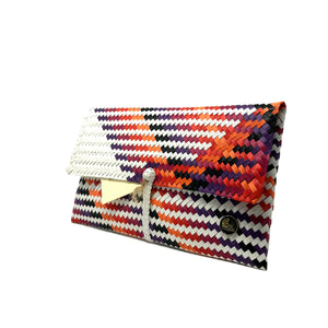 Orange, purple and white clutch at a 45-degree angle.