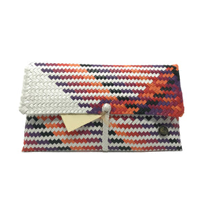 Handmade orange, purple and white clutch facing the front.