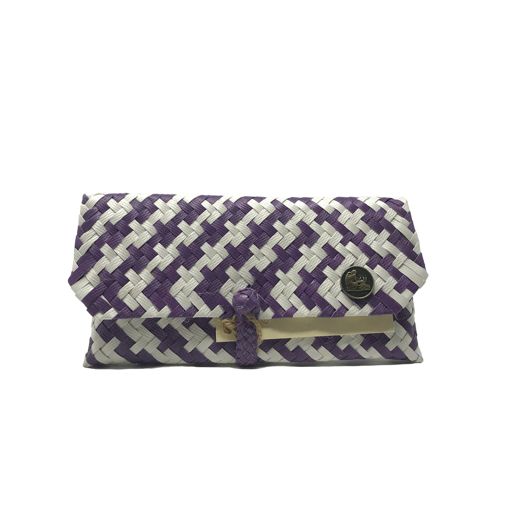 Handmade purple and white wristlet facing the front.