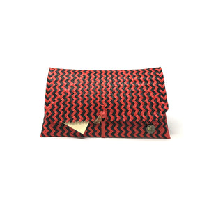 Handmade red and black clutch facing the front.