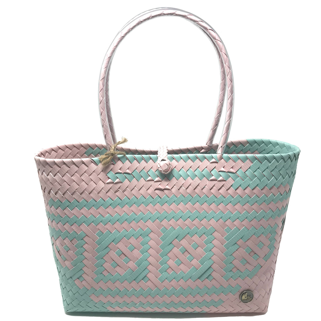 Handmade pink and turquoise small size tote bag facing the front.