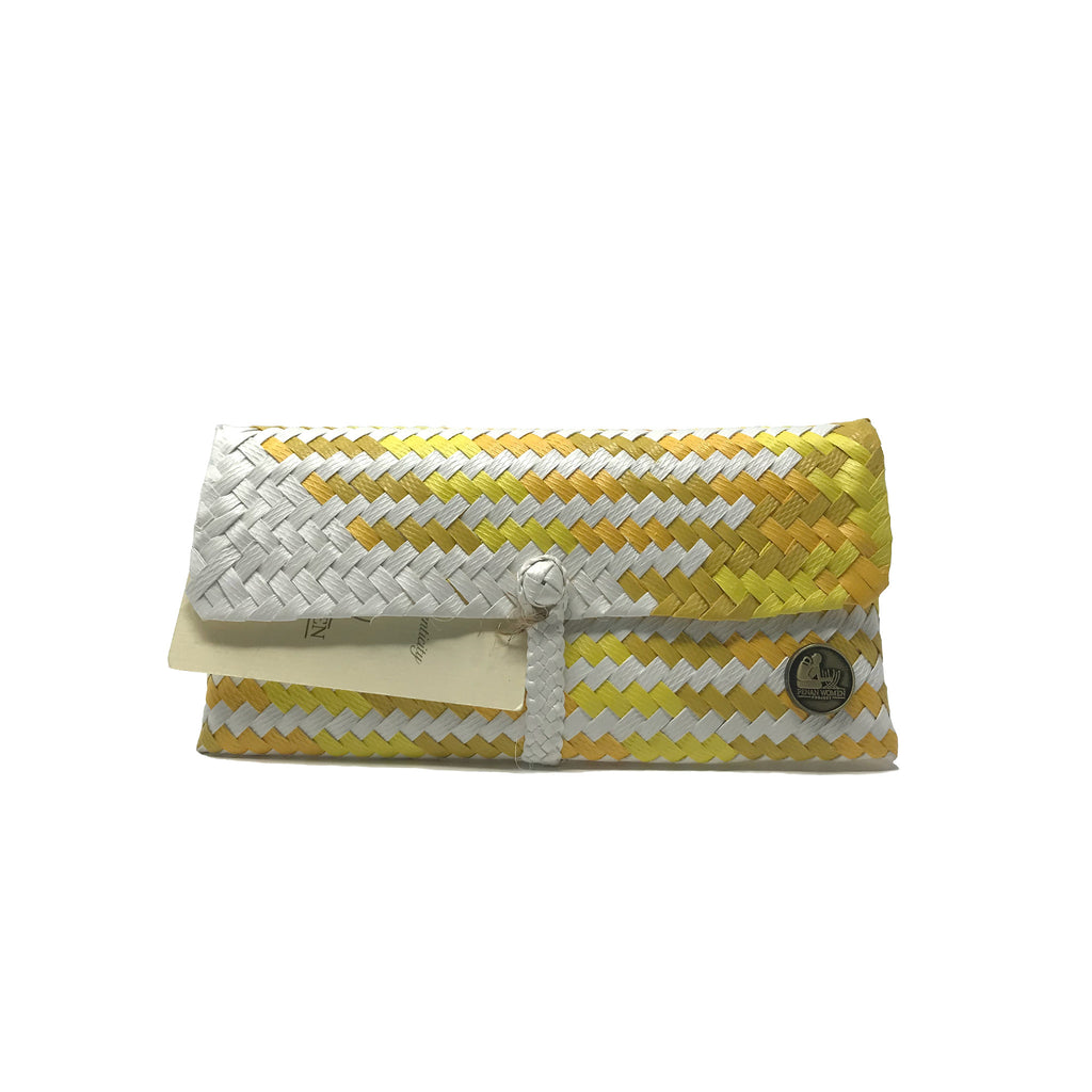 Handmade yellow, ochre and white wristlet facing the front.