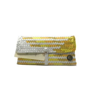 Handmade yellow, ochre and white wristlet facing the front.